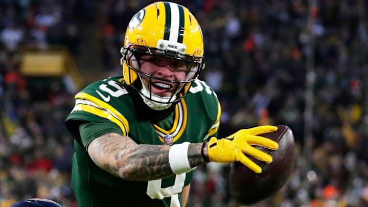 Green Bay Packers wide receiver Christian Watson (9) runs the ball in for a touchdown during a football game against the Chicago Bears on Dec. 7, 2025, at Lambeau Field in Green Bay, Wis. The Packers defeated the Bears 28-21.