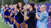 The late Mia Hamant is shown with here University of Washington soccer teammates. 