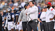 UConn offensive coordinator Gordon Sammis looks on during a Huskies football game. 