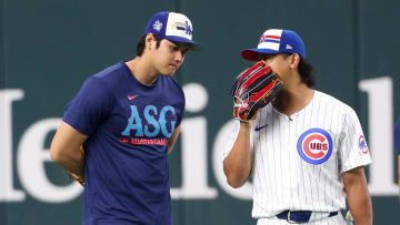 Jul 15, 2024; Arlington, TX, USA; Los Angeles Dodgers pitcher Shohei Ohtani speaks with Chicago Cubs pitcher Shota Imanaga (r) before the 2024 Home Run Derby at Globe Life Field.
