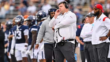 UConn offensive coordinator Gordon Sammis looks on during a Huskies football game. 