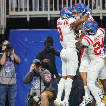 Dec 30, 2023; Atlanta, GA, USA; Mississippi Rebels tight end Caden Prieskorn (86) celebrates with wide receiver Tre Harris (9) and running back Ulysses Bentley IV (24) after a touchdown catch against the Penn State Nittany Lions in the first quarter at Mercedes-Benz Stadium. Mandatory Credit: Brett Davis-USA TODAY Sports
