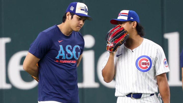 Jul 15, 2024; Arlington, TX, USA; Los Angeles Dodgers pitcher Shohei Ohtani speaks with Chicago Cubs pitcher Shota Imanaga (r) before the 2024 Home Run Derby at Globe Life Field