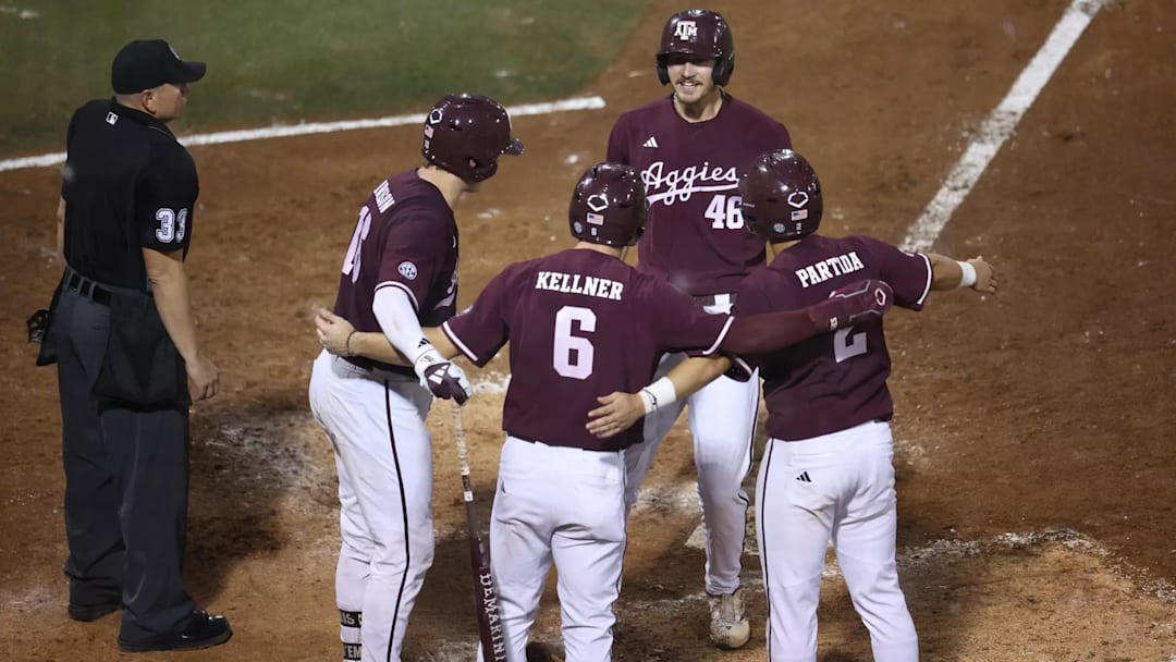 Texas A&M Aggies first baseman Blake Binderup celebrates at home plate with Bear Harrison (16), Boston Kellner (6), and Nico Partida (2).