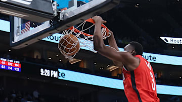 Oct 7, 2024; Salt Lake City, Utah, USA; Houston Rockets center N'Faly Dante (3) dunks against Utah Jazz forward Drew Eubanks (15) during the fourth quarter at Delta Center. Mandatory Credit: Rob Gray-Imagn Images
