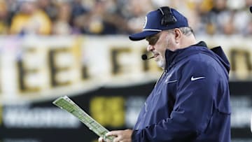 Oct 6, 2024; Pittsburgh, Pennsylvania, USA;  Dallas Cowboys head coach Mike McCarthy looks at his play chart against the Pittsburgh Steelers during the second quarter at Acrisure Stadium. Mandatory Credit: Charles LeClaire-Imagn Images