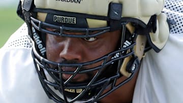 Purdue Boilermakers defensive lineman Mo Omonode (92) lines up for a drill Friday, Aug. 16, 2024, during Purdue football practice at Bimel Outdoor Practice Complex in West Lafayette, Ind.