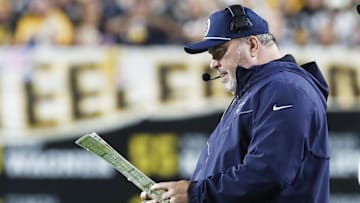 Oct 6, 2024; Pittsburgh, Pennsylvania, USA;  Dallas Cowboys head coach Mike McCarthy looks at his play chart against the Pittsburgh Steelers during the second quarter at Acrisure Stadium.