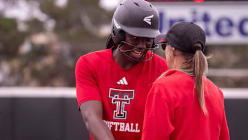 Texas Tech's NiJaree Canady talks to first base coach Tara Archibald during a fall softball exhibition Sunday, October 20, 2024, at Rocky Johnson Field.