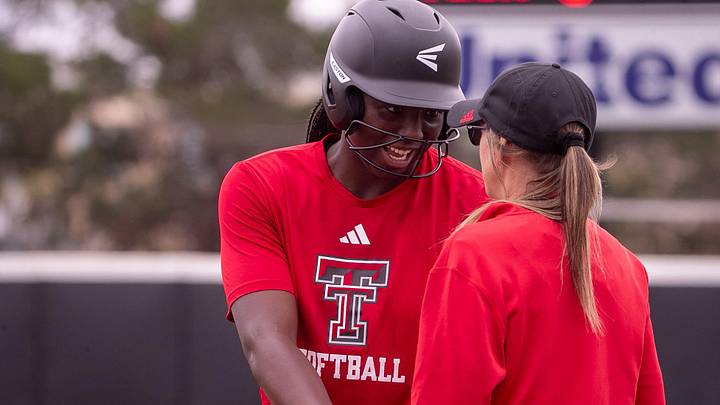 Texas Tech's NiJaree Canady talks to first base coach Tara Archibald during a fall softball exhibition Sunday, October 20, 2024, at Rocky Johnson Field.