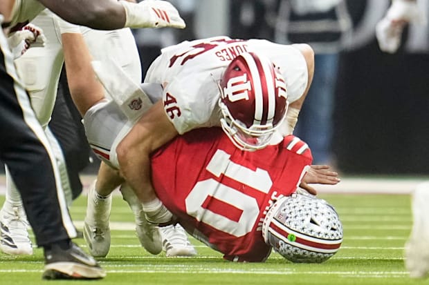 Indiana linebacker Isaiah Jones hits Ohio State quarterback Julian Sayin during the first half of the Big Ten championship.