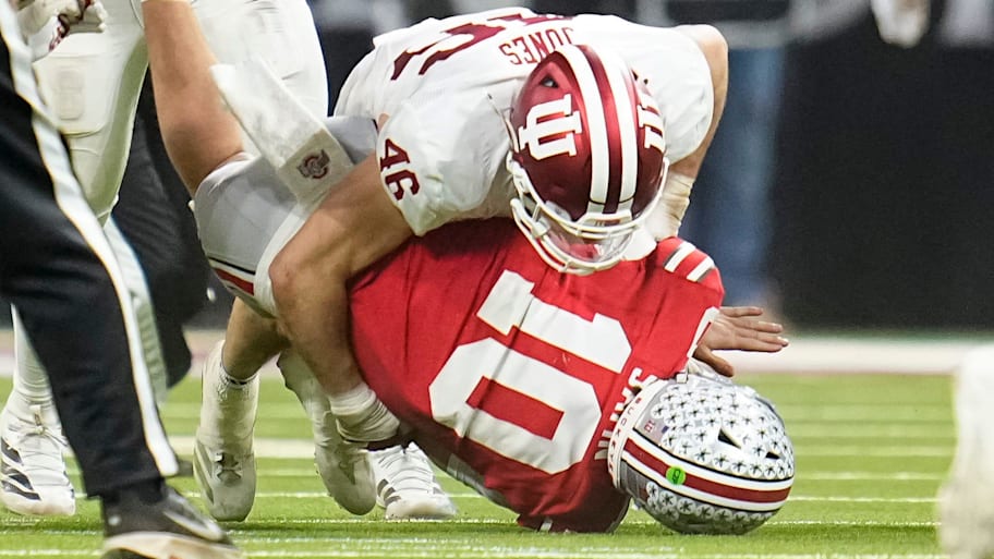 Indiana linebacker Isaiah Jones hits Ohio State quarterback Julian Sayin during the first half of the Big Ten championship.