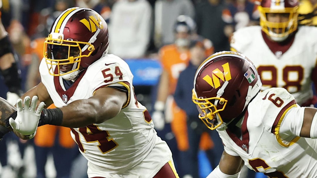 Nov 30, 2025; Landover, Maryland, USA; Denver Broncos tight end Evan Engram (1) runs with the ball as Washington Commanders linebacker Bobby Wagner (54) and Commanders cornerback Noah Igbinoghene (6) chase in the third quarter at Northwest Stadium. Mandatory Credit: Geoff Burke-Imagn Images