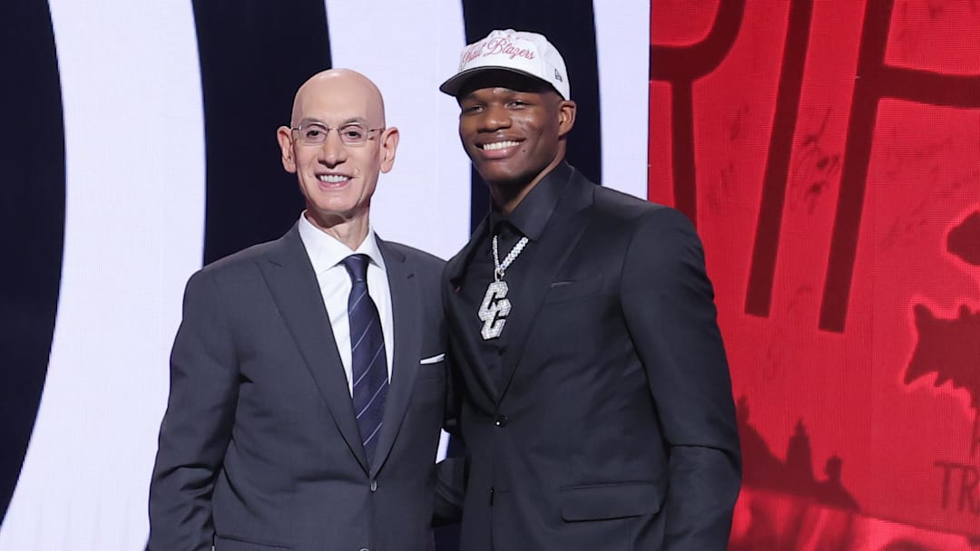 Jun 25, 2025; Brooklyn, NY, USA;  Cedric Coward stands with NBA commissioner Adam Silver after being selected as the 11th pick by the Portland Trail Blazers in the first round of the 2025 NBA Draft at Barclays Center. Mandatory Credit: Brad Penner-Imagn Images