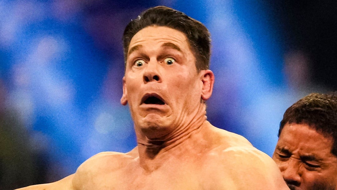 Jey Uso pushes John Cena off the ring Saturday, Feb. 1, 2025, during the WWE Royal Rumble at Lucas Oil Stadium in Indianapolis.