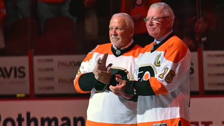 Oct 27, 2016; Philadelphia, PA, USA; Philadelphia Flyers greats goalie Bernie Parent (1) and Bobby Clarke (16) on ice during ceremony before game against Arizona Coyotes at Wells Fargo Center.