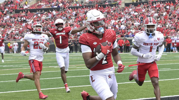 Aug 31, 2024; Louisville, Kentucky, USA;  Louisville Cardinals wide receiver Jadon Thompson (2) scores a touchdown against the Austin Peay Governors during the second quarter at L&N Federal Credit Union Stadium. 