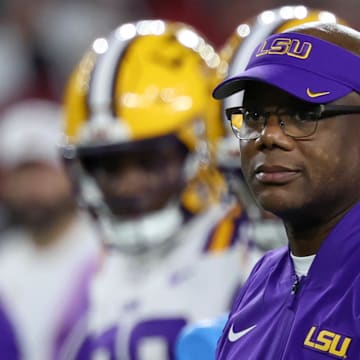 Louisiana State Tigers interim head coach Frank Wilson looks on during warmups prior to the game against the Alabama Crimson Tide at Saban Field at Bryant-Denny Stadium.
