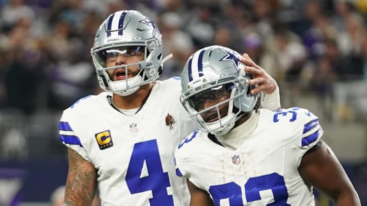Dallas Cowboys running back Javonte Williams celebrates with QB Dak Prescott after a touchdown against the Minnesota Vikings