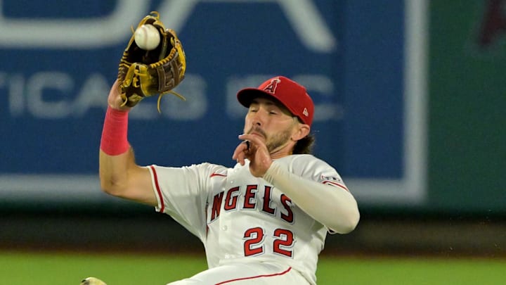 Sep 23, 2025; Anaheim, California, USA;  Los Angeles Angels center fielder Bryce Teodosio (22) makes a sliding catch off a ball hit by Kansas City Royals right fielder Mike Yastrzemski (18) during the fifth inning at Angel Stadium. Mandatory Credit: Jayne Kamin-Oncea-Imagn Images