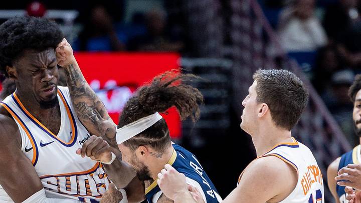 Dec 27, 2025; New Orleans, Louisiana, USA;  New Orleans Pelicans guard Jose Alvarado (15) gets into a scrum with Phoenix Suns center Mark Williams (15) over a play during the second half at Smoothie King Center. Mandatory Credit: Stephen Lew-Imagn Images