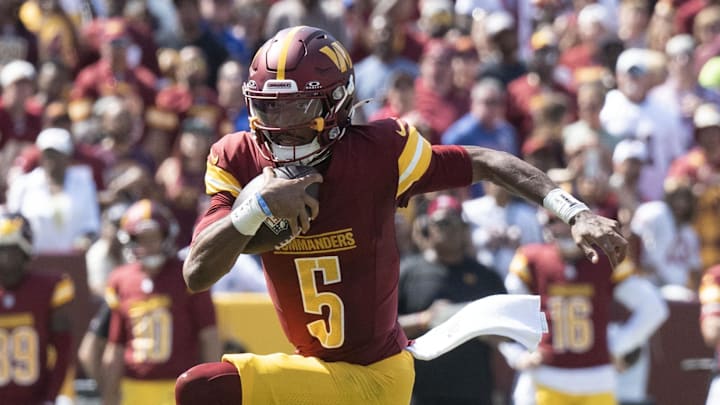 Sep 15, 2024; Landover, Maryland, USA; Washington Commanders quarterback Jayden Daniels (5) runs down the field in the first half against the New York Giants at Commanders Field. Mandatory Credit: Luke Johnson-Imagn Images

