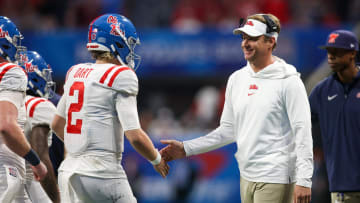 Dec 30, 2023; Atlanta, GA, USA; Mississippi Rebels head coach Lane Kiffin celebrates with quarterback Jaxson Dart (2) after a touchdown against the Penn State Nittany Lions in the second half at Mercedes-Benz Stadium. Mandatory Credit: Brett Davis-USA TODAY Sports
