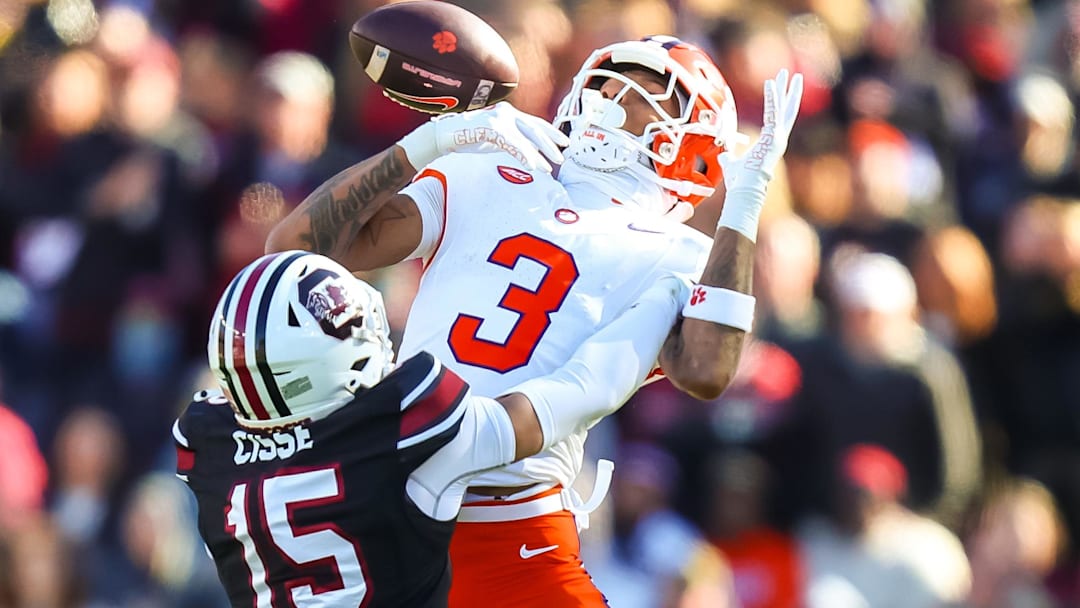 Nov 29, 2025; Columbia, South Carolina, USA; South Carolina Gamecocks cornerback Brandon Cisse (15) breaks up a pass intended for Clemson Tigers wide receiver Tristan Smith (3) in the third quarter at Williams-Brice Stadium. Mandatory Credit: Jeff Blake-Imagn Images