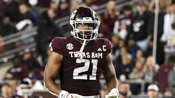 Nov 30, 2024; College Station, Texas, USA; Texas A&M Aggies linebacker Taurean York (21) reacts against the Texas Longhorns during the second half. The Longhorns defeated the Aggies 17-7 at Kyle Field. Mandatory Credit: Maria Lysaker-Imagn Images  