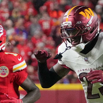 Oct 27, 2025; Kansas City, Missouri, USA; Kansas City Chiefs wide receiver Xavier Worthy (1) is unable to make a reception defended by Washington Commanders cornerback Trey Amos (23) during the first quarter of the game at GEHA Field at Arrowhead Stadium. Mandatory Credit: Denny Medley-Imagn Images