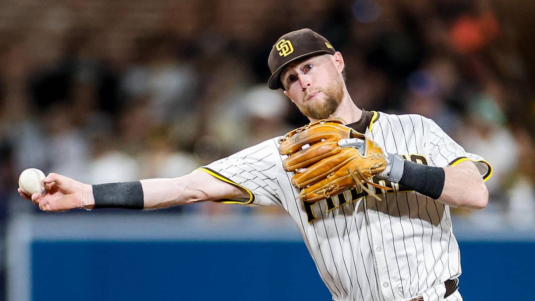 Sep 13, 2025; San Diego, California, USA; San Diego Padres shortstop Jake Cronenworth (9) throws to first base for an out during the sixth inning against the Colorado Rockies at Petco Park. Mandatory Credit: David Frerker-Imagn Images