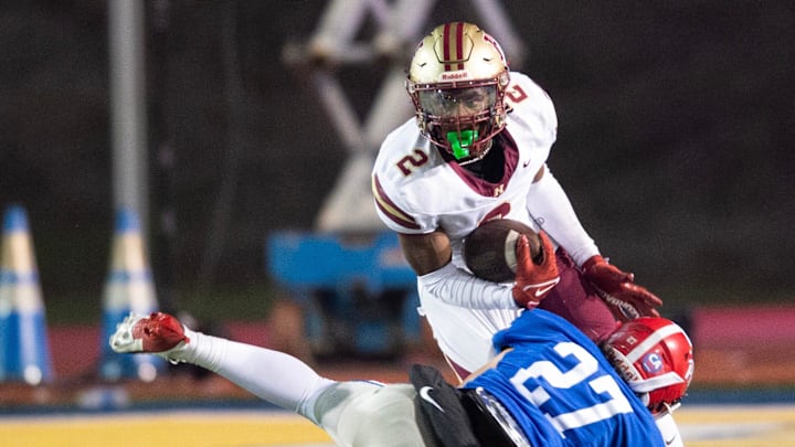 Hartfield's Bralan Womack (2) cuts to get past Prep's Russell Robbins (27) during the MAIS 6A championship at Mississippi College in Clinton, Miss., Saturday, Nov. 23, 2024. Hartfield won by a score of 19-14.