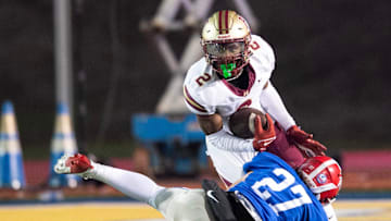 Hartfield's Bralan Womack (2) cuts to get past Prep's Russell Robbins (27) during the MAIS 6A championship at Mississippi College in Clinton, Miss., Saturday, Nov. 23, 2024. Hartfield won by a score of 19-14.