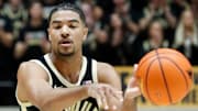 Purdue Boilermakers guard C.J. Cox (0) passes the ball 