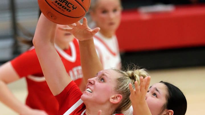 Kimberly High School's Ava Van Vonderen (34) pulls down a rebound against Neenah High School's Farrah Danforth (32) during their girls basketball game Thursday, February 19, 2026, at Neenah High School in Fox Crossing, Wisconsin. Kimberly won 64-50. Kimberly High School's Ava Van Vonderen (34) pulls down a rebound against Neenah High School's Farrah Danforth (32) during their girls basketball game Thursday, February 19, 2026, at Neenah High School in Fox Crossing, Wisconsin. Kimberly won 64-50.