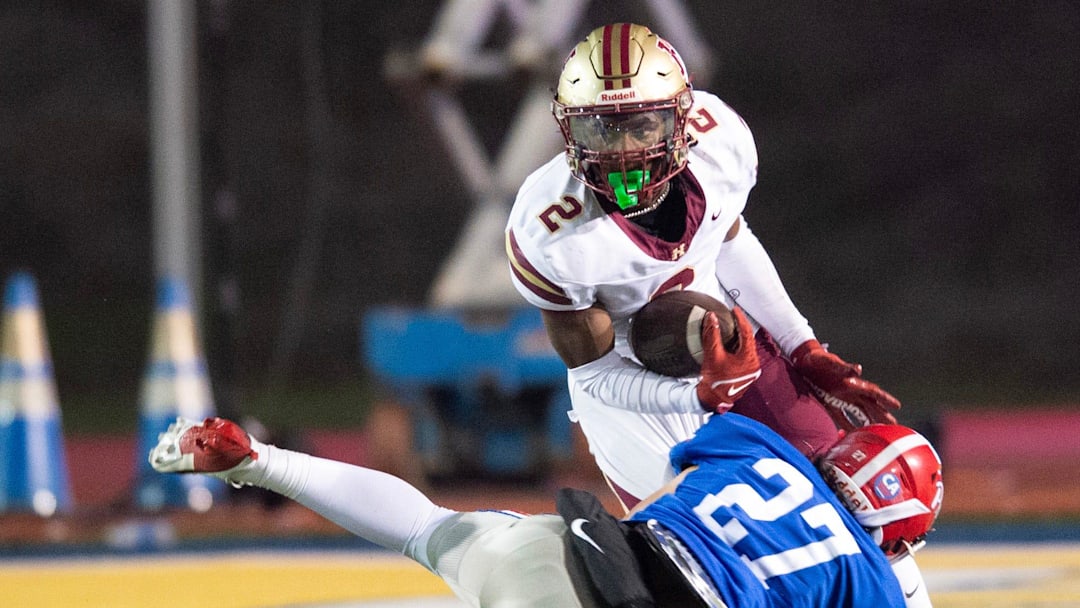Hartfield's Bralan Womack (2) cuts to get past Prep's Russell Robbins (27) during the MAIS 6A championship at Mississippi College in Clinton, Miss., Saturday, Nov. 23, 2024. Hartfield won by a score of 19-14.