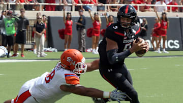 Sep 5, 2015; Lubbock, TX, USA; Sam Houston State Bearkats defensive tackle James DeLaRosa (68) tries to tackle Texas Tech Red Raiders quarterback Patrick Mahomes II (5) during the first half at Jones AT&T Stadium. Mandatory Credit: Michael C. Johnson-Imagn Images