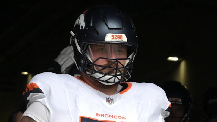 Sep 21, 2025; Inglewood, California, USA;  Denver Broncos guard Ben Powers (74) and defensive tackle Eyioma Uwazurike (96) wait to enter the field for the game against the Los Angeles Chargers at SoFi Stadium. Mandatory Credit: Jayne Kamin-Oncea-Imagn Images
