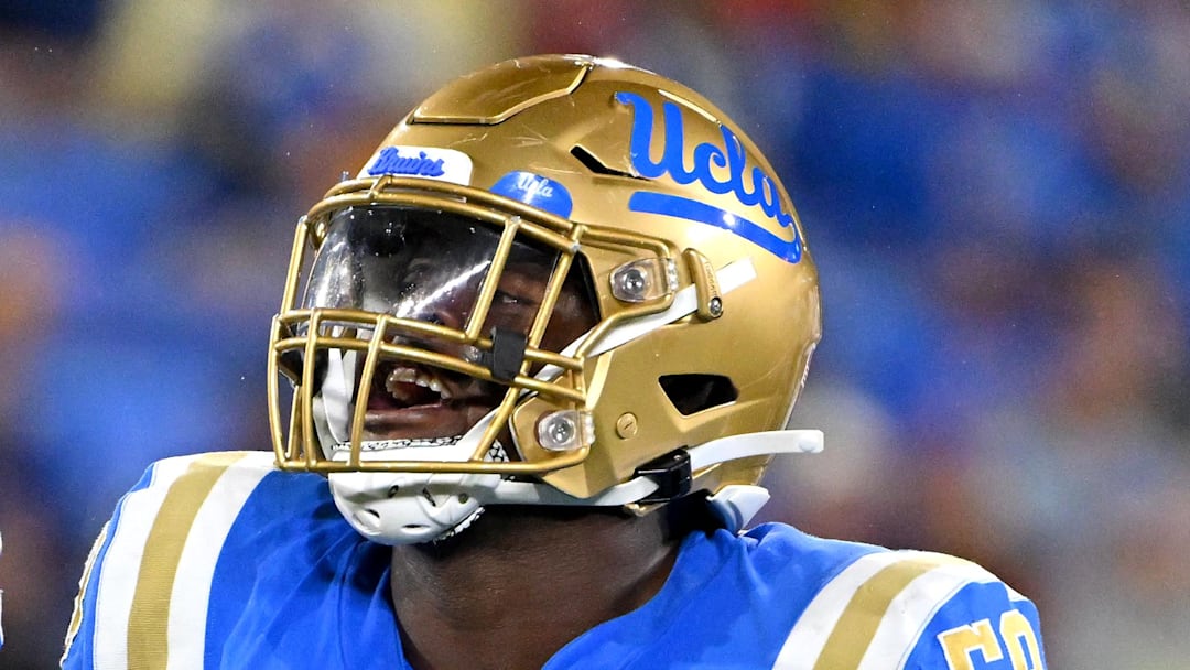 Oct 29, 2022; Pasadena, California, USA;  UCLA Bruins linebacker Laiatu Latu (15) and defensive lineman Gary Smith III (58) celebrate after a sack of Stanford Cardinal quarterback Tanner McKee (18)  in the first half at the Rose Bowl. Mandatory Credit: Jayne Kamin-Oncea-Imagn Images
