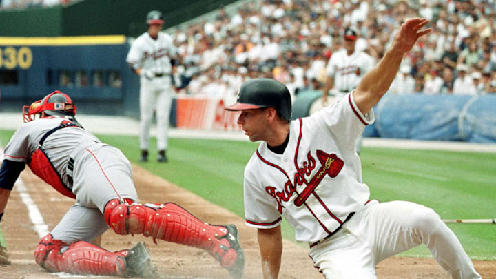 Atlanta Braves' Walt Weiss slides in past the tag