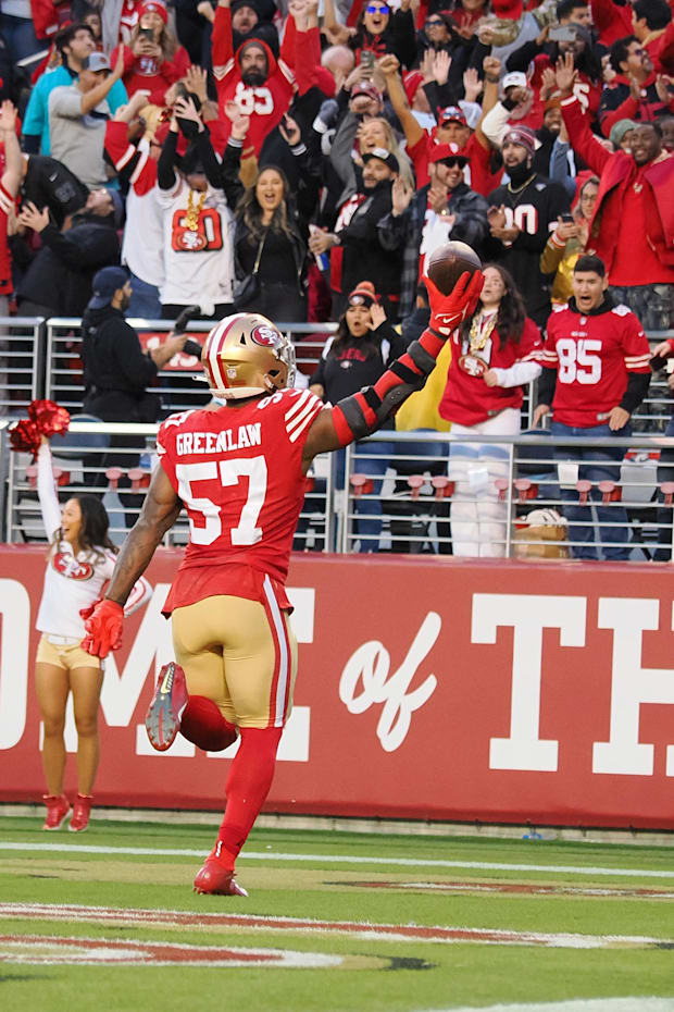 San Francisco 49ers LB Dre Greenlaw celebrates after scoring a touchdown on a fumble recovery against the Miami Dolphins.