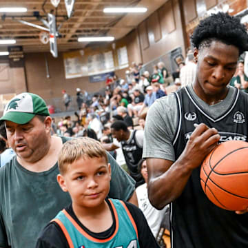 Michigan State's Cam Ward signs autographs during the Moneyball Pro-Am on Tuesday, June 24, 2025, at Holt High School.