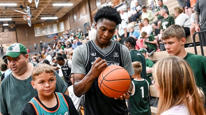 Michigan State's Cam Ward signs autographs during the Moneyball Pro-Am on Tuesday, June 24, 2025, at Holt High School.