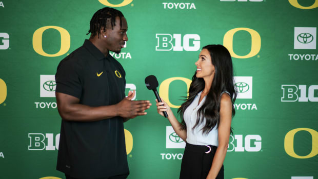 Oregon Ducks linebacker Jeffrey Bassa and Oregon Sports Reporter Bri Amaranthus