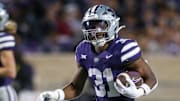 Nov 16, 2024; Manhattan, Kansas, USA; Kansas State Wildcats running back DJ Giddens (31) runs the ball against the Arizona State Sun Devils during the third quarter at Bill Snyder Family Football Stadium. Mandatory Credit: Scott Sewell-Imagn Images