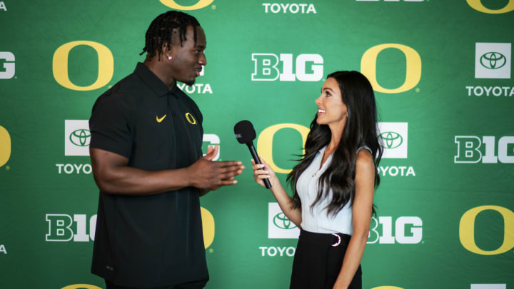 Oregon Ducks linebacker Jeffrey Bassa and Oregon Sports Reporter Bri Amaranthus