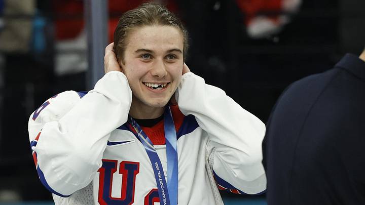 Jack Hughes (86) of the United States reacts after receiving his gold medal: Geoff Burke-Imagn Images