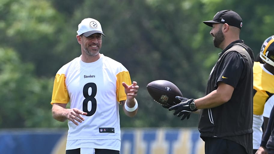Pittsburgh Steelers quarterback Aaron Rodgers (8) gets the ball during minicamp at their South Side facility. | Philip G. Pavely-Imagn Images