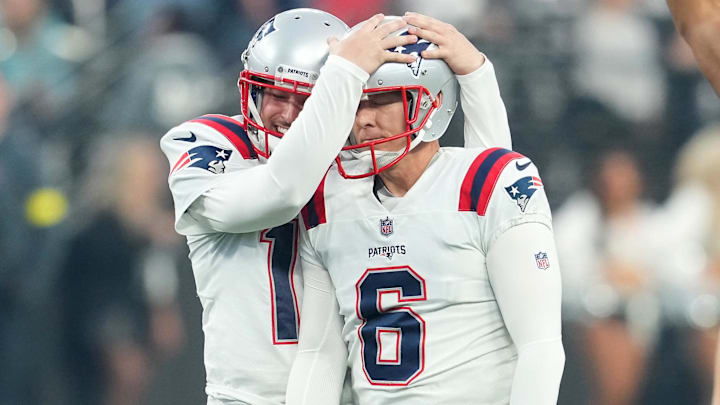 Former New England Patriots place kicker Nick Folk (6) is congratulated by wide receiver Tyquan Thornton (11) after kicking a field goal against the Las Vegas Raiders during the second half at Allegiant Stadium.