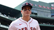 Boston Red Sox left fielder Roman Anthony (19) runs onto the field against the Miami Marlins at Fenway Park. 